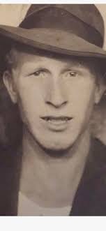 This is the home place of my mother, Manda Lou (Dean) Adkins in the “Dean  Holler.” She is standing and holding my brother who just turned 80. My  grandmother, Maude (Bradshaw) Dean