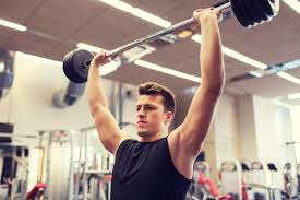 The seated dumbbell press is in itself a variation of the barbell overhead/shoulder press which swaps the dumbbells for a barbell and is performed standing up. Seated Barbell Military Press Strong Shoulders Workout The Fitness Tribe