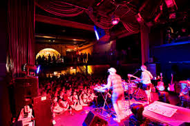 The area in an airport where passengers wait before getting onto an aircraft 2. Best Live Music Venues In Nyc For Every Type Of Show Thrillist