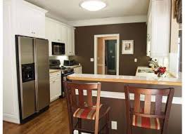 kitchen white cabinets brown walls