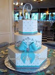 Elegant White And Tiffany Blue Wedding Cake With Bling Tiffany Blue Wedding Cake Wedding Cakes Blue Tiffany Sweet 16