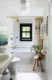 A Montauk Beach House Designed By Roman And Williams Black Window Frames Bathroom Tub Shower Bathroom Trends
