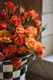 Orange Roses Desire Excitement Enthusiasm Beautiful Arrangement Looks Like A Mckenzie Childs Bucket Orange Roses Flowers Beautiful Flowers