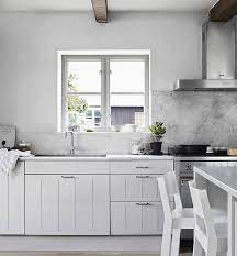We salute that the kitchen chooses the tiles that look very bright that contrast with the wooden cabinet, cupboard, and floor of the kitchen. 9 Kitchen Window Backsplash Ideas