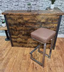 Minimalist bar stool featuring a sturdy industrial leather seat and backrest. Secondhand Pub Equipment Bar Stools