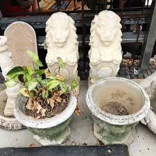 This concrete sun and moon stepping stone can also be used as a wall plaque. Concrete Lion Garden Statues Grand Ideas