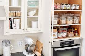The area provides a combination of shelf and door storage for spices, dry goods, and small kitchen appliances. 7 Ways To Organize Your Kitchen Pantry