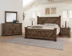 A beautiful vintage modern bedroom set that includes a low dresser, highboy dresser, and two nightstands. Cool Rustic Artisan Post By Vaughan Bassett