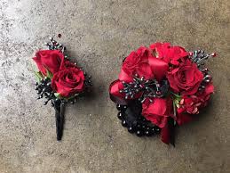 Matching Red And Black Boutonniere And Wrist Corsage Prom Flowers Corsage Prom Corsage And Boutonniere Homecoming Flowers