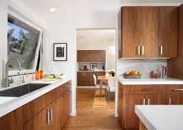 The gorgeous window wall brings in plenty of natural light and the pendant lights over the island make this a standout kitchen. Mid Century Modern Kitchen Flooring Mid Century Modern Kitchen Design Kitchen Design Decor Mid Century Modern Kitchen Cabinets