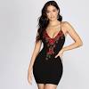 This black cover up is detailed with gorgeous floral embroidery, a comfy flowy fit and adjustable drawstring closure at the waist. 1