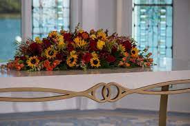 Kristine and leslie had a beach destination wedding in april in isabela, puerto rico. Wedding Altarpiece Of Red Roses And Sunflowers Transferred To Sweetheart Table At Wedding Red Roses And Sunflowers Red Rose Wedding Disney Wedding Centerpieces