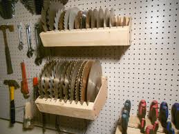 Saw Blade Holders To Store Different Size Saw Blades Used This Method To Hook It To The Peg Board Tool Storage Diy Woodworking Shop Layout Diy Garage Storage