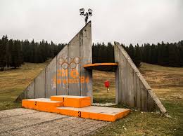 The spectator sections have been left to the elements and have become overgrown with weeds and garbage. Photos Of What Abandoned 1984 Sarajevo Olympic Venues Look Like Today