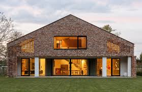 The old window on the house's left side was enlarged to accommodate two french doors. Old Brick New House Wrzeszcz Architekci Archdaily
