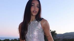 Dua Lipa surprises fans with a form-fitting black dress one day before her birthday