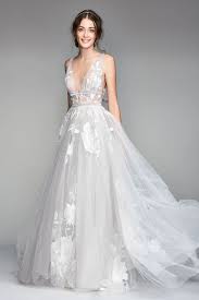 A Chic Neutral Wedding Dress From Watters Featuring A Deep V Neckline And Elegant Floral Appliques Wedding Dress Necklines Watters Wedding Dress Plunging Neckline Wedding Dress