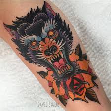 Bright Wild Fierce Symmetrical Wolf Head And Rose On Upper Inner Arm Traditional Color Tattoo David Bruehl R Traditional Tattoo Body Art Tattoos Wolf Tattoos