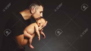Her last name, echikunwoke, means leader of men and megalyn is the granddaughter of a nigerian tribal. Newborn Baby In His Father S Hands In The Dark On A Black Background Stock Photo Picture And Royalty Free Image Image 76170645