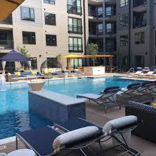Kor Chaise Lounges And Trace Umbrellas Chroma Luxury Apartments St Louis Installation Outdoor Patio Furniture Sets Outdoor Garden Planters Outdoor Patio