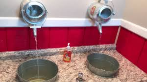 faucet and metal bucket sink