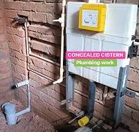 Concealed toilet cistern installation in brick wall