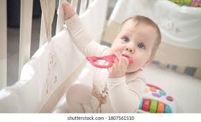 Baby Sitting Up In Crib Stock Photos Images Photography Shutterstock
