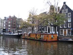 Amsterdam House Boats On Canals Lg Loved This Particular Houseboat With All Of Its Flowers Amsterdam Houses House Boat Canals