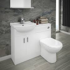 This chic shelf unit features a slim rod around the shelf edges so nothing falls off into the toilet, as well as a rod to hang towels. The Cove Combined Sink And Toilet Unit Includes A Basin Wc Toilet And A Bathroom Stor Small Bathroom Sinks Simple Bathroom Designs Small Space Bathroom Design