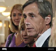 Chris Daggett, independent candidate for New Jersey governor, speaks with  reporters after voting Tuesday, Nov. 3, 2009 at Fellowship Village in  Basking Ridge, N.J. Also shown are Daggett's daughter Ali, left, and