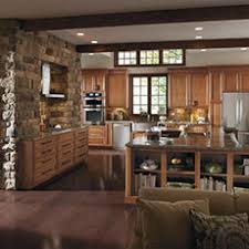 The same type of wood and same color of stain on both the upper and lower cabinets. Rustic Kitchen Cabinets Cabinetry Styles Masterbrand