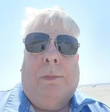 What assists tilting the cab?