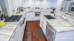 You cannot go wrong with many color schemes concerning white cabinets. Fantasy Brown Kitchen Quartzite Modern Countertop Marble Com