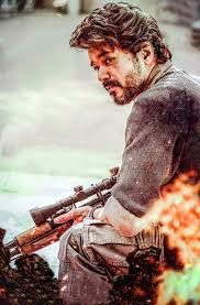 Download Beast Vijay Kneeling With Gun Wallpaper | Wallpapers.com