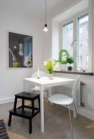 A trio of neutral colors and subtle shapes make up the room décor of this fresh country look. 14 Functional Dining Room Ideas For Small Apartments