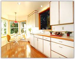 white kitchen cabinets with stained