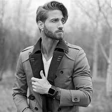 Medium Length Hair Man With Trench Coat Short Beard With Mustache And Earring Side Swept P Medium Length Hair Men Medium Length Hair Styles Haircuts For Men