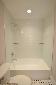 Oversized Tub Shower Combo With Light Blue Tile Shower Shelves And Large Rainfall Shower Head Tub Shower Combo Shower Tub Tub Remodel