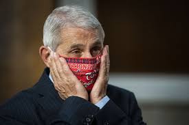 Dr fauci adjusts his mask. Dr Fauci Tells Marketwatch I Would Not Get On A Plane Or Eat Inside A Restaurant Marketwatch