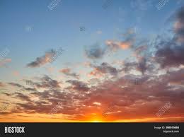 Green grass field during sunset. Beautiful Soft Clouds Image Photo Free Trial Bigstock