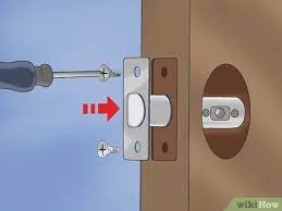 Slide the outside parts of the lockset into the hole, through the latch assembly. 3 Ways To Change Door Locks Wikihow