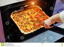 Woman Cut With A Knife Homemade Pizza In Electric Oven In The Kitchen Stock Image Image Of Knife Woman 71225657