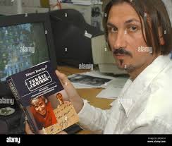 Hristo Hristov, a journalist investigating one of the most notorious Cold  War killings of Bulgarian dissident Georgi Markov, shows his new book,  titled "Kill Vagabond", Wednesday, June 15, 2005, in Sofia, Bulgaria.