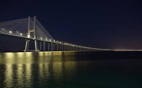 Kundenbewertungen lesen, schiffe und routen online vergleichen, günstig buchen! Hd Wallpaper Vasco Da Gama Bridge At Night Brown Suspension Bridger City Wallpaper Flare