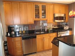 Maple Wood Cabinetry In Honey Color W Ceasarstone Counter Top The Shiny Black Counter Tops Comp Trendy Kitchen Backsplash Black Countertops Modern Oak Kitchen