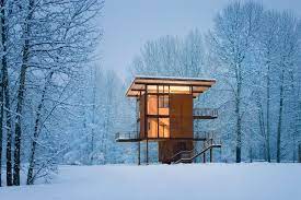 The project, known as the 'false bay writer's cabin', was designed by olson kundig as a glass house surrounded by three wooden slat decks. Olson Kundig Delta Shelter