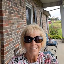 My goat was fine last night. This morning she walked with her neck bent  side ways. .when she head butts she falls over.