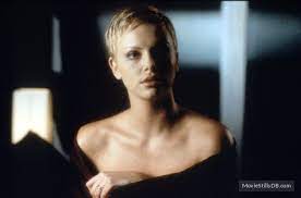 A pair of shuttle astronauts leave their spacecraft to repair a satellite. The Astronaut S Wife Publicity Still Of Charlize Theron The Astronaut S Wife Charlize Theron Short Blonde Pixie