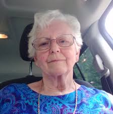 What was the name of the gas station across from Erb Lumber in Hillman,  Michigan?