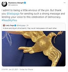 The damage cannot be contained. Fans Compare Lady Gaga S Enormous Gold Brooch To The Hunger Games Mockingjay Pin Daily Mail Online